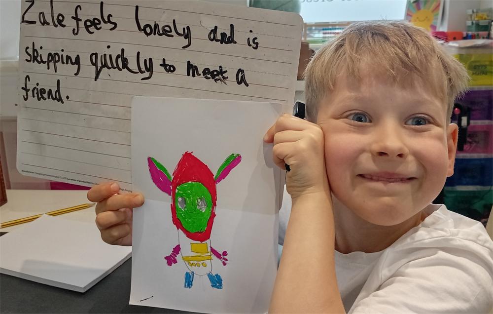 A pupil proudly sharing their work