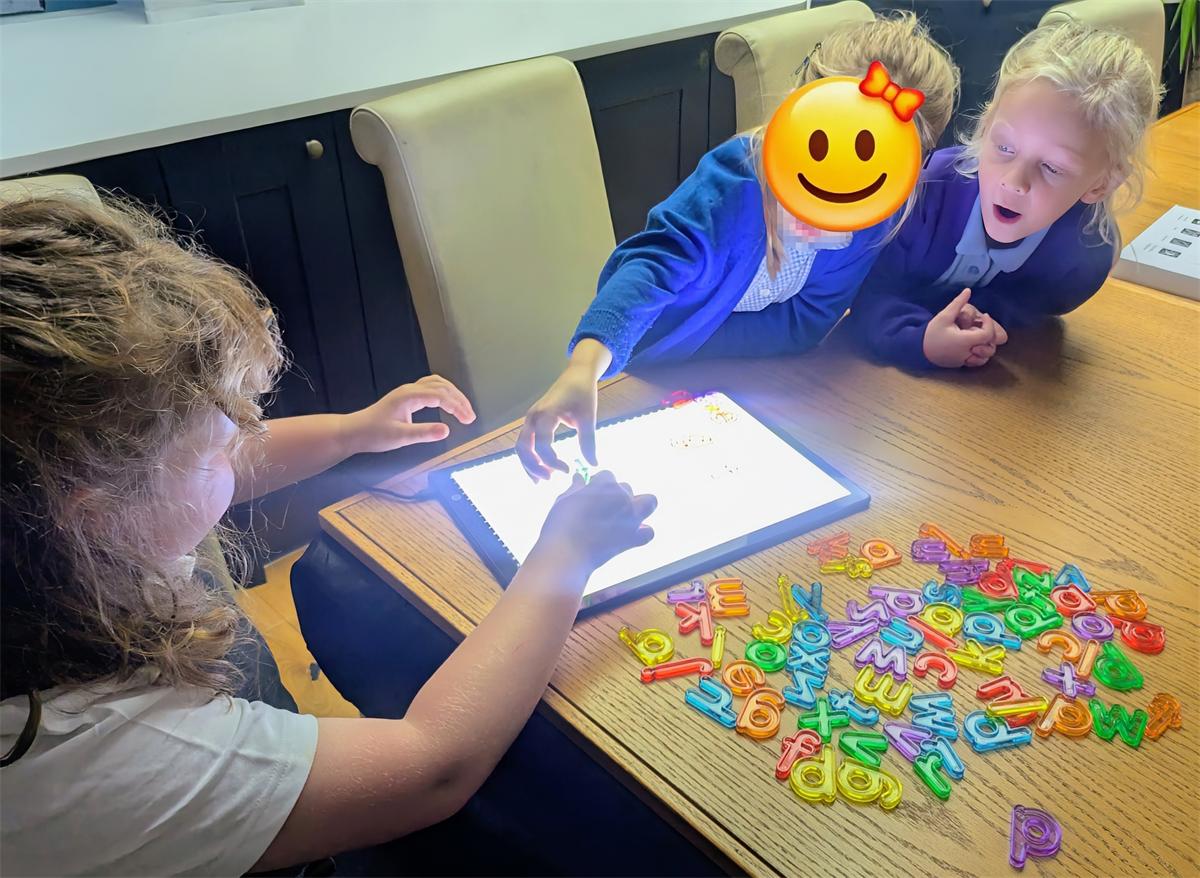 A pupil concentrating on a hands-on activity