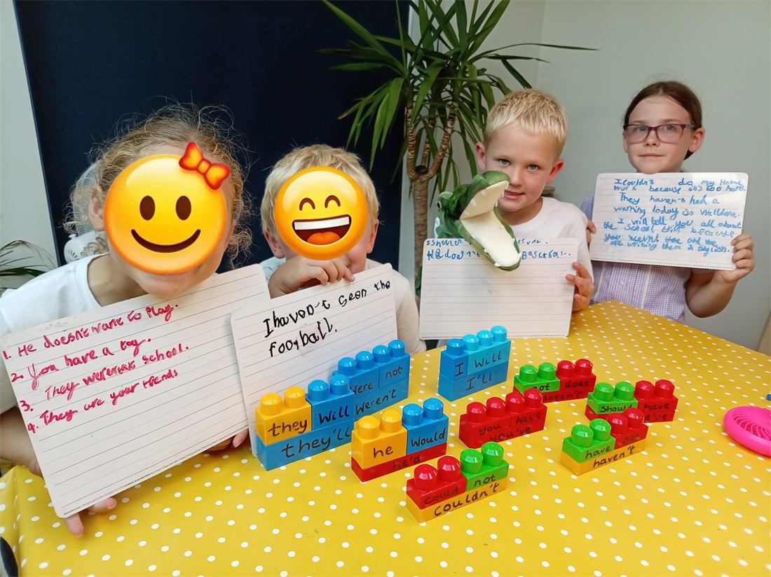 A small group of children learning together at the table