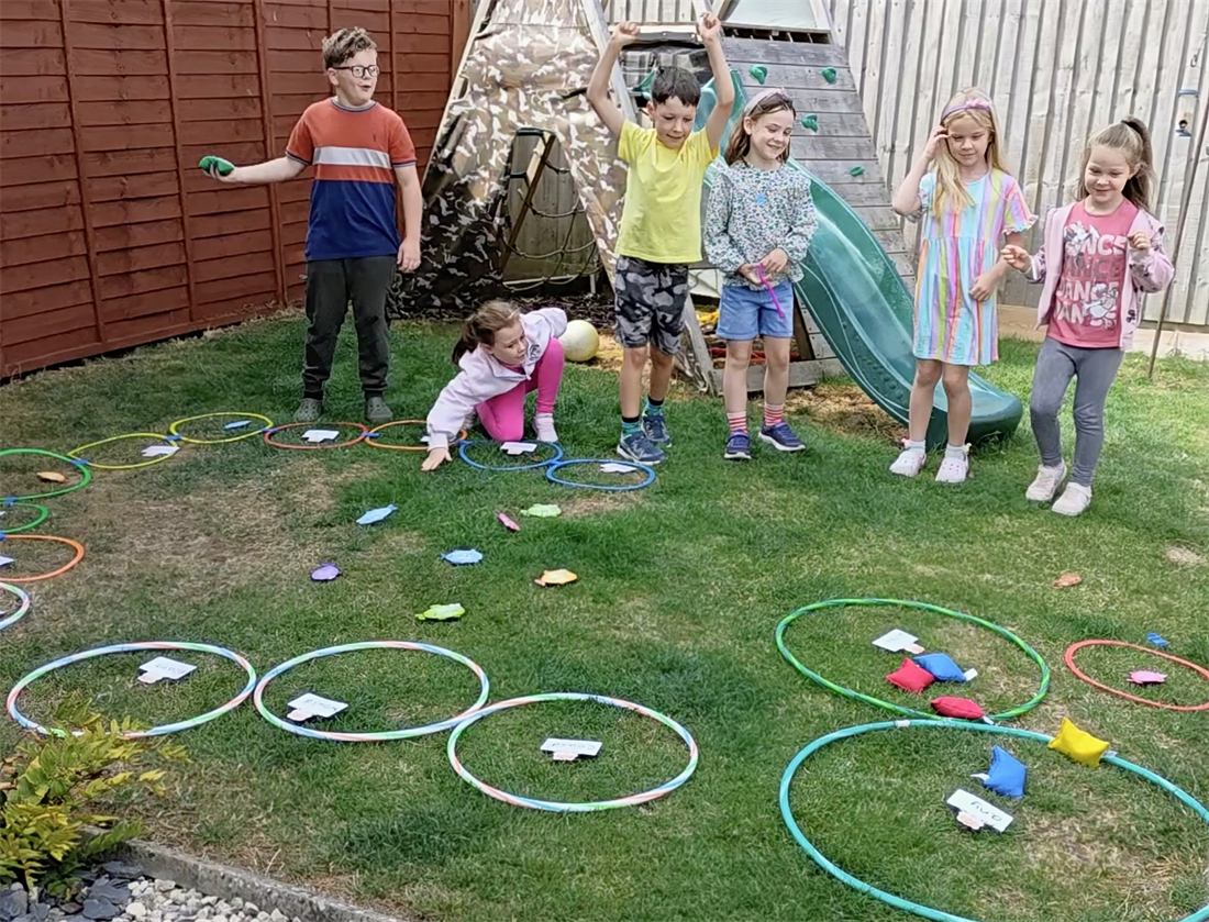 Children enjoying outdoor games at a holiday session